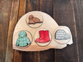 Completed Igloo Peekaboo Puzzle showcasing vibrant letters and matching symbols like a walrus, coat, boots, and an igloo, perfect for pre-K and preschool activities.