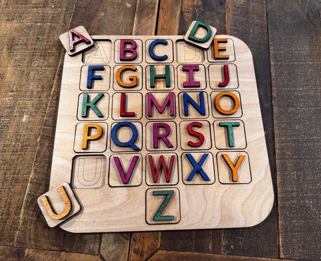 Handcrafted wooden alphabet puzzle board for preschool and Pre K learning. Encourages fine motor skills, cognitive growth, and social-emotional development. Ideal for learning the alphabet, letter recognition, and pre-reading skills through interactive play. Perfect for daycare, homeschool, and developmentally appropriate practice