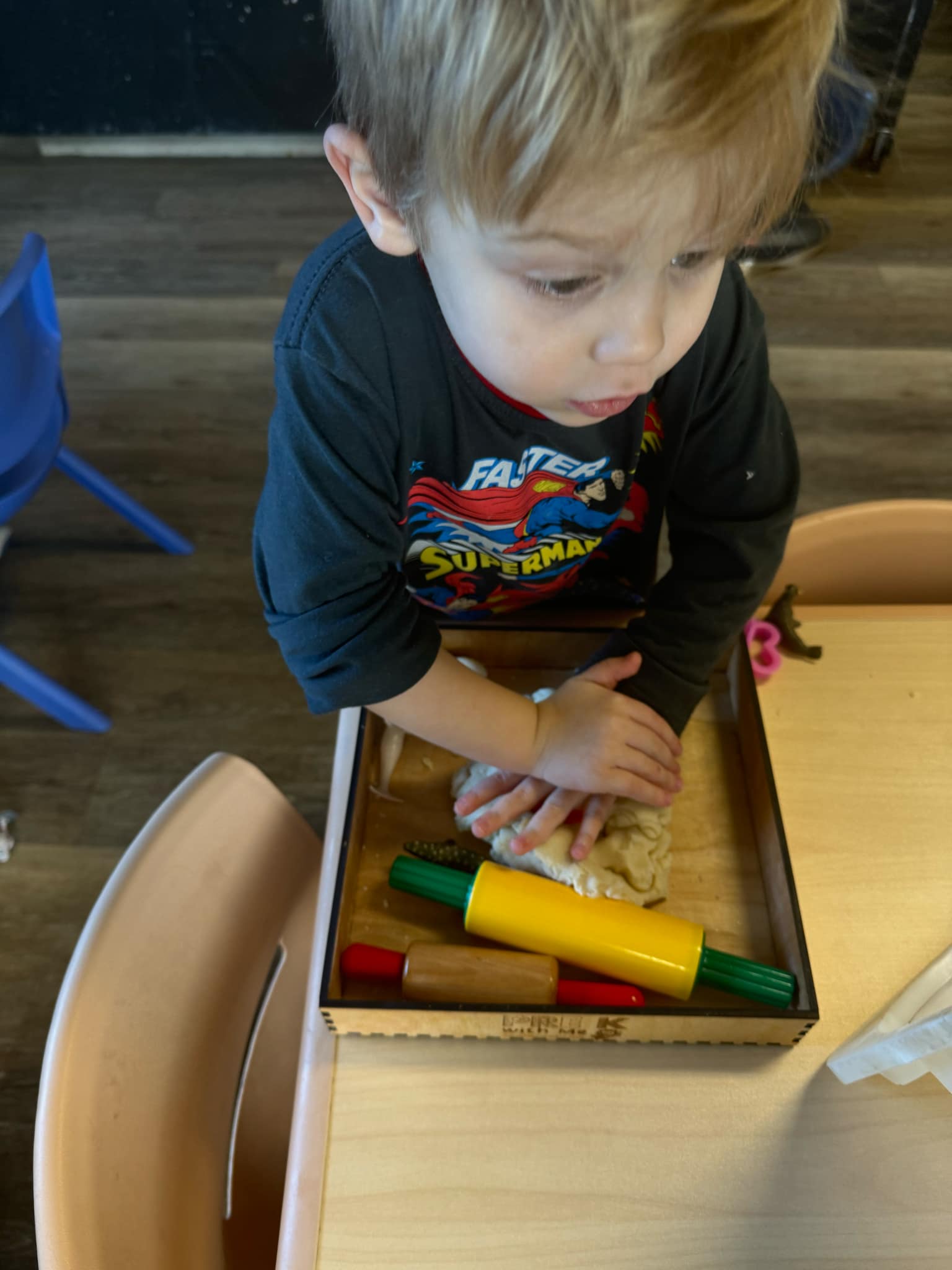 Close-up of a preschooler using the PreKwithMe sensory bin for hands-on exploration, perfect for fostering cognitive growth and critical thinking in pre-K settings.