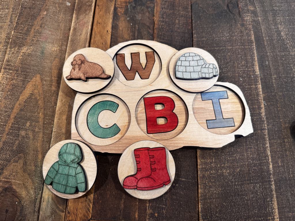 Igloo-shaped peekaboo puzzle featuring W for Walrus, C for Coat, B for Boot, and I for Igloo, with colorful wooden letters and symbols for preschool learning.